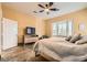 Bright bedroom with large bed, a ceiling fan, and stylish decor at 151 Cliff Valley Dr, Las Vegas, NV 89148