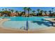 Large community pool featuring wading area, palm trees, deck space, and views of Gathering recreation area at 151 Cliff Valley Dr, Las Vegas, NV 89148