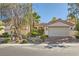 Charming single-story home features a well-manicured front yard and attached two-car garage at 151 Cliff Valley Dr, Las Vegas, NV 89148