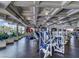 Well-lit gym with floor-to-ceiling windows, various exercise machines, and a view of outdoor greenery at 151 Cliff Valley Dr, Las Vegas, NV 89148