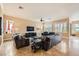 Spacious living room featuring comfortable seating, tile floors, and large windows at 151 Cliff Valley Dr, Las Vegas, NV 89148