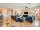 Open-concept living room with tile floors, ample seating, and abundant natural light at 151 Cliff Valley Dr, Las Vegas, NV 89148
