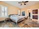 Main bedroom features travertine floors, shutters and ensuite bath at 151 Cliff Valley Dr, Las Vegas, NV 89148