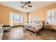 Main bedroom offers natural lighting, travertine floors, and a comfortable space at 151 Cliff Valley Dr, Las Vegas, NV 89148