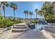 Gorgeous backyard featuring a sparkling pool with rock waterfall and meticulously landscaped surroundings at 151 Cliff Valley Dr, Las Vegas, NV 89148
