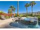Relaxing backyard spa with rock accents and lush greenery providing a serene outdoor experience at 151 Cliff Valley Dr, Las Vegas, NV 89148
