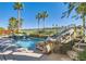 Stunning backyard pool and spa area with rock waterfall feature and lush tropical landscaping at 151 Cliff Valley Dr, Las Vegas, NV 89148