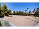 A sand volleyball court with water park in background surrounded by greenery, perfect for outdoor fun at 151 Cliff Valley Dr, Las Vegas, NV 89148