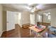 Bedroom with wood floors, ceiling fan, and sliding mirror closet doors at 1557 Lake Placid Ter # 1557, Henderson, NV 89014