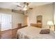 Primary bedroom with wood laminate flooring and ensuite bathroom access at 1557 Lake Placid Ter # 1557, Henderson, NV 89014