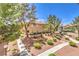 Well-maintained complex grounds with lush landscaping and mature trees at 1557 Lake Placid Ter # 1557, Henderson, NV 89014
