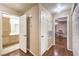 Hallway with bathroom and room entrance; wood laminate flooring at 1557 Lake Placid Ter # 1557, Henderson, NV 89014