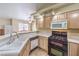 Updated kitchen featuring stainless steel appliances and a double sink at 1557 Lake Placid Ter # 1557, Henderson, NV 89014