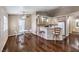 Bright open kitchen and dining area features wood floors and ample counter seating at 1557 Lake Placid Ter # 1557, Henderson, NV 89014