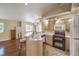 Open kitchen view with stainless steel appliances and updated fixtures and bar seating at 1557 Lake Placid Ter # 1557, Henderson, NV 89014