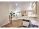 Kitchen featuring stainless steel appliances and an open view into the living room at 1557 Lake Placid Ter # 1557, Henderson, NV 89014