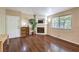 Cozy living room featuring hardwood floors, a fireplace, a window with natural light, and neutral paint at 1557 Lake Placid Ter # 1557, Henderson, NV 89014