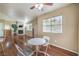 Comfortable living area featuring a table set, hardwood floors, natural light, and neutral paint at 1557 Lake Placid Ter # 1557, Henderson, NV 89014