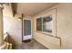 View of an apartment's porch featuring a window, door, and a column on the left side at 1557 Lake Placid Ter # 1557, Henderson, NV 89014