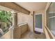 Exterior view of a porch featuring a column, door, railing and a window at 1557 Lake Placid Ter # 1557, Henderson, NV 89014