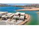 Waterfront home with a modern design and lush landscaping overlooking a serene lake at 1600 Pleasant Bay Ct, Henderson, NV 89011