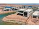 View of modern home on cul-de-sac street with nearby new construction and lake access at 1600 Pleasant Bay Ct, Henderson, NV 89011