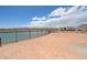 The backyard features a fence with mountain views and a view of the water at 1600 Pleasant Bay Ct, Henderson, NV 89011