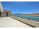 Large balcony overlooking a serene lake, perfect for outdoor relaxation and enjoying picturesque waterfront views at 1600 Pleasant Bay Ct, Henderson, NV 89011