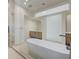 Sleek bathroom with a glass shower, soaking tub, and floating vanity at 1600 Pleasant Bay Ct, Henderson, NV 89011