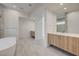 Bright bathroom featuring double vanities, a soaking tub, and modern finishes at 1600 Pleasant Bay Ct, Henderson, NV 89011