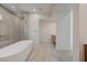 Bathroom with modern tub and glass enclosed shower at 1600 Pleasant Bay Ct, Henderson, NV 89011