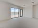 Bright bedroom with neutral carpet and sliding glass doors to the outside at 1600 Pleasant Bay Ct, Henderson, NV 89011
