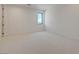 This bright and airy bedroom features neutral carpeting and a view of the landscape at 1600 Pleasant Bay Ct, Henderson, NV 89011