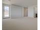 This bedroom has neutral carpeting and a door leading to a patio overlooking mountains at 1600 Pleasant Bay Ct, Henderson, NV 89011