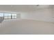 Expansive bonus room bathed in natural light, with a neutral color palette and recessed lighting throughout at 1600 Pleasant Bay Ct, Henderson, NV 89011