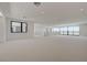Open bonus room with large windows, showcasing modern design and plenty of flexible living space at 1600 Pleasant Bay Ct, Henderson, NV 89011