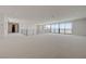 Bright bonus room with lake views, contemporary railing, and ample space for various activities at 1600 Pleasant Bay Ct, Henderson, NV 89011