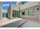 Contemporary courtyard featuring large glass windows and geometric paving stones at 1600 Pleasant Bay Ct, Henderson, NV 89011