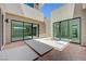Sleek courtyard with sliding glass doors offering access to the home's interior at 1600 Pleasant Bay Ct, Henderson, NV 89011