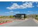Community entry features a gatehouse with covered parking and beautiful desert landscaping at 1600 Pleasant Bay Ct, Henderson, NV 89011