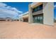 Exterior view of the rear of the home and a view of the expansive backyard at 1600 Pleasant Bay Ct, Henderson, NV 89011