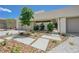 Landscaped front yard with modern walkway and desert-friendly plants at 1600 Pleasant Bay Ct, Henderson, NV 89011