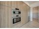 Built-in oven, refrigerator, and wood cabinetry at 1600 Pleasant Bay Ct, Henderson, NV 89011