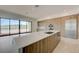 Open kitchen with an island, wood cabinets and stainless appliances at 1600 Pleasant Bay Ct, Henderson, NV 89011