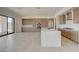 Open kitchen with wood cabinetry, a center island, and stainless steel appliances at 1600 Pleasant Bay Ct, Henderson, NV 89011