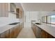 Modern kitchen with cooktop and wood cabinets at 1600 Pleasant Bay Ct, Henderson, NV 89011