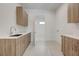 Laundry room featuring plenty of cabinet space and modern finishes at 1600 Pleasant Bay Ct, Henderson, NV 89011