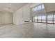 Bright living room featuring modern fireplace, large windows, and tile flooring at 1600 Pleasant Bay Ct, Henderson, NV 89011