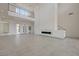 Bright living room with modern fireplace and access to multiple rooms at 1600 Pleasant Bay Ct, Henderson, NV 89011