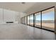 Spacious living room with tiled flooring and expansive lake views at 1600 Pleasant Bay Ct, Henderson, NV 89011